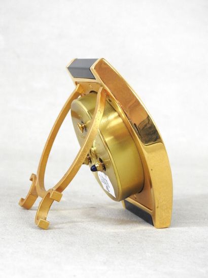 CARTIER
Gilt metal travel clock, blue Tortue...