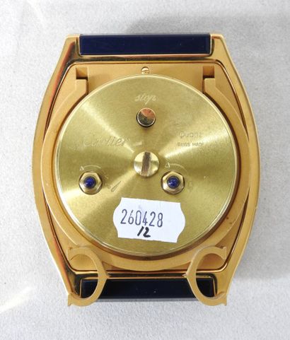 CARTIER
Gilt metal travel clock, blue Tortue...