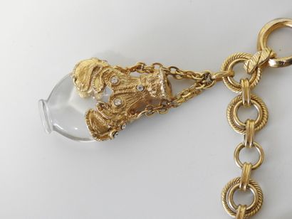 A large piece of costume jewelry, with gilded...