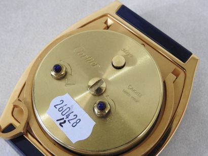 CARTIER
Gilt metal travel clock, blue Tortue...