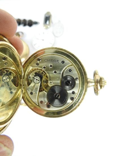 OMEGA. Gilt metal pocket watch, white enamel...