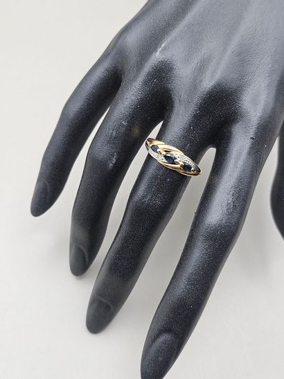 BAGUE en or jaune et gris 750 millièmes ornée...