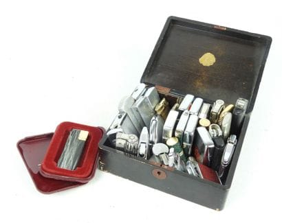 COLLECTION OF 23 BRIQUETS including Zippo....