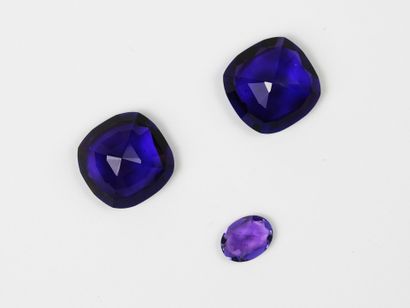 THREE AMETHYSTS on paper, two cushion-cut...