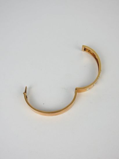 BRACELET rigide en or jaune 750/1000° agrémenté...