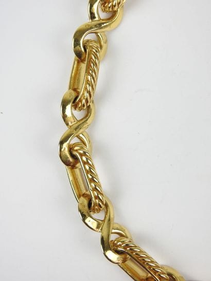 YVES SAINT LAURENT - Paris. Gold-plated metal...