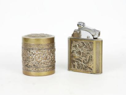 Cylindrical silver box decorated with a floral...