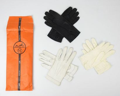 Pair of white peccary gloves. Size 6.5. Worn...