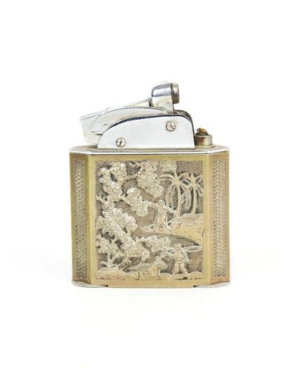 Cylindrical silver box decorated with a floral...