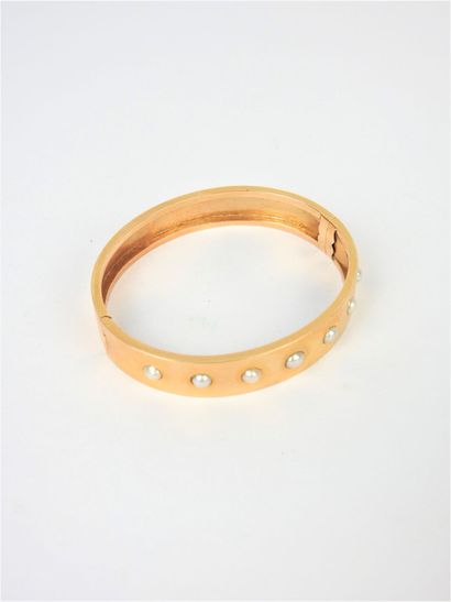 BRACELET rigide en or jaune 750/1000° agrémenté...