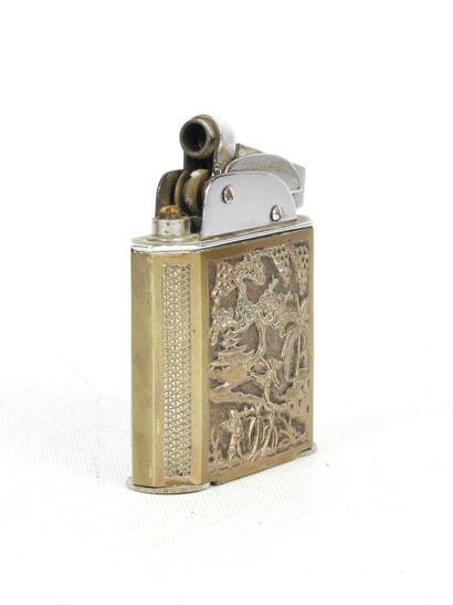 Cylindrical silver box decorated with a floral...