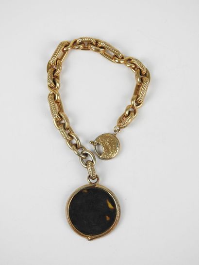 YVES SAINT LAURENT - Paris. Bracelet en métal...