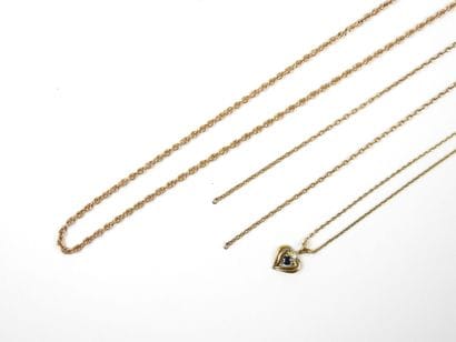 COSTUME JEWELRY. Set includes ring, chains,...