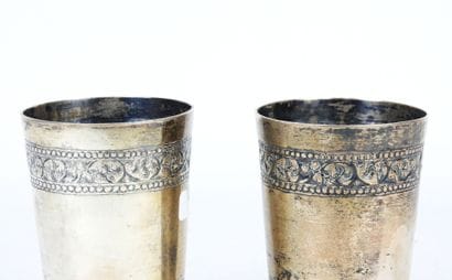 TWO silver GOBELETS with chased floral frieze...