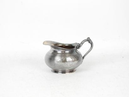CHRISTOFLE. Silver-plated milk jug with guilloché...