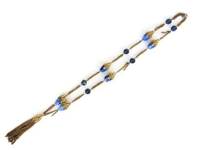 Gilded metal and blue glass beads SAUTOIR....