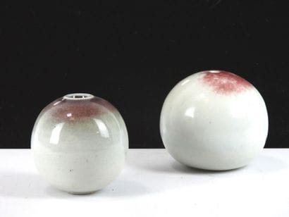 REUNION OF TWO glazed ceramic ball vases...