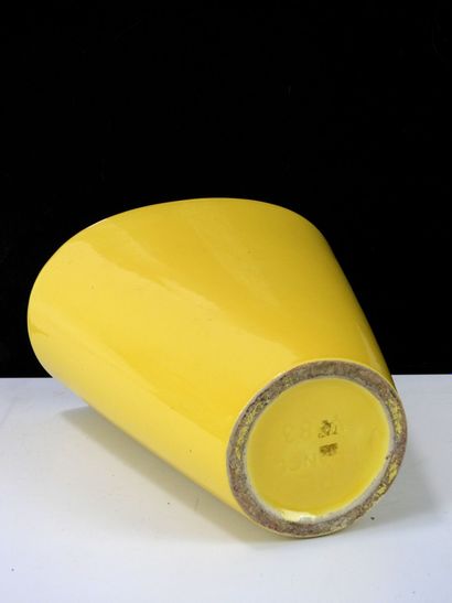 Glazed ceramic vase with yellow glaze and...