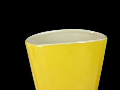 Glazed ceramic vase with yellow glaze and...