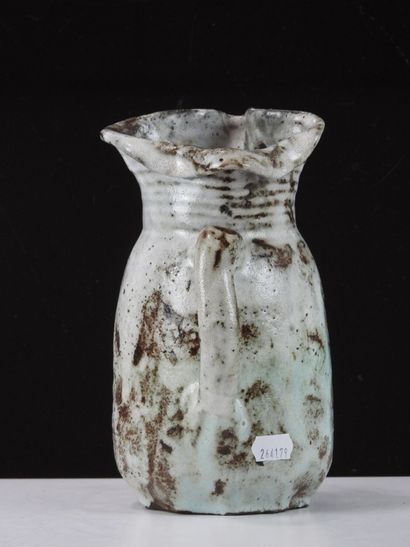 Eugène LION (1867-1945).
Stoneware pitcher...