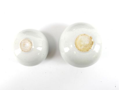 REUNION OF TWO glazed ceramic ball vases...