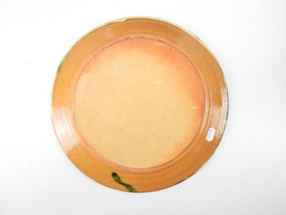 Turned glazed earthenware dish with abstract...