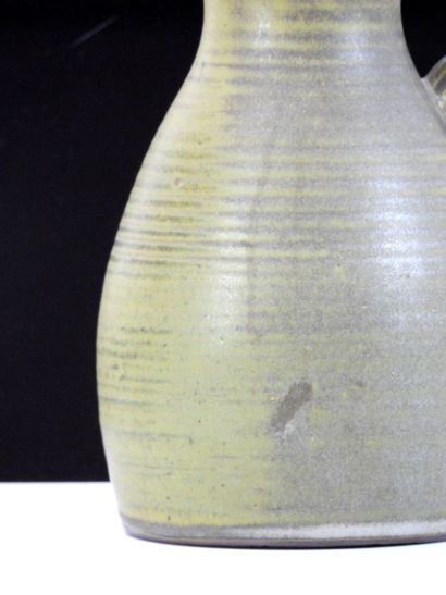 TAIZE
Large stoneware pitcher with green...