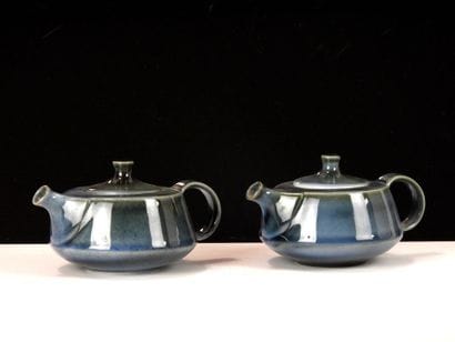 VIREBENT. 
Two small teapots in blue enameled...