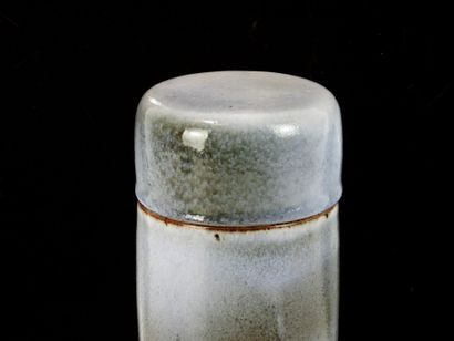 Covered cylindrical box in blue and brown...