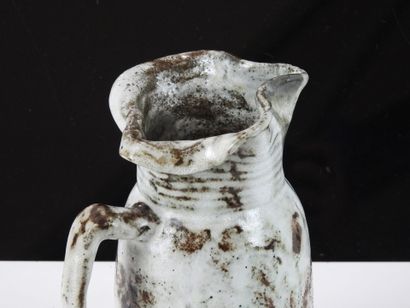 Eugène LION (1867-1945).
Stoneware pitcher...