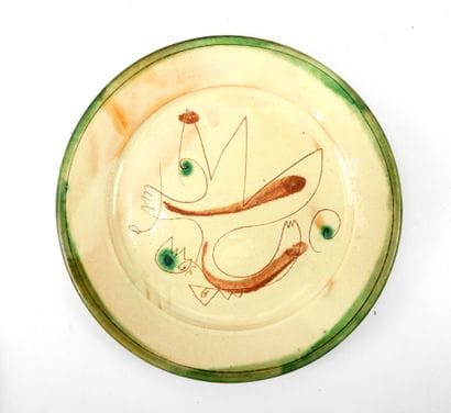 Turned glazed earthenware dish with abstract...