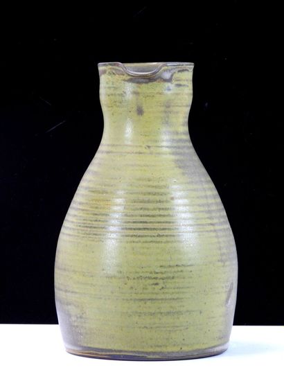 TAIZE
Large stoneware pitcher with green...