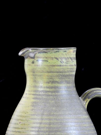 TAIZE
Large stoneware pitcher with green...