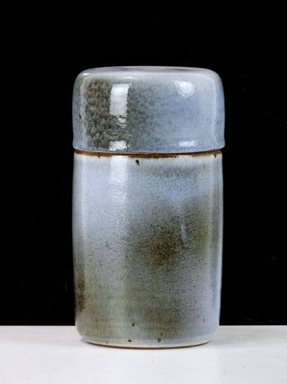 Covered cylindrical box in blue and brown...