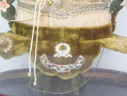 Bride figurine with a crown, displayed on...