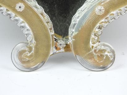 Venetian glass mirror with floral design....