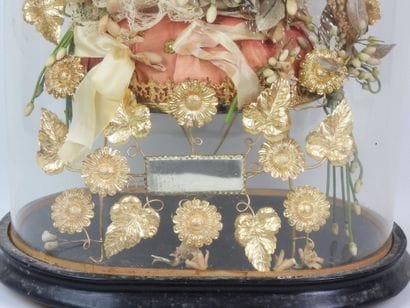 Bride figurine with a crown, mounted on a...
