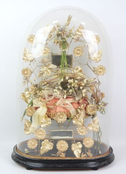Bride figurine with a crown, mounted on a...
