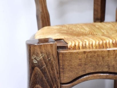 BAUMANN. Six wooden chairs with straw seats....