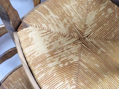 BAUMANN. Six wooden chairs with straw seats....