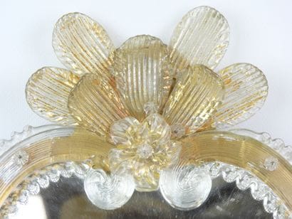 Venetian glass mirror with floral design....