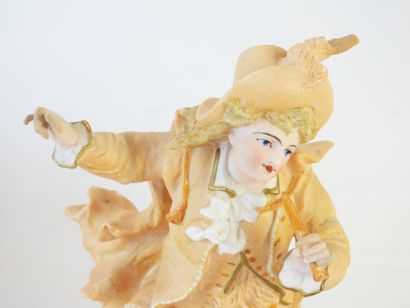 PAIRE DE STATUES représentant un couple d'élégants...