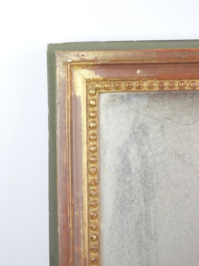 Rectangular gilded wooden mirror adorned...