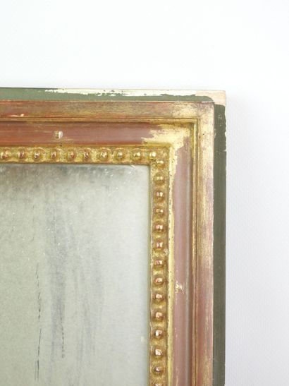 Rectangular gilded wooden mirror adorned...