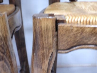 BAUMANN. Six wooden chairs with straw seats....