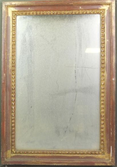 Rectangular gilded wooden mirror adorned...