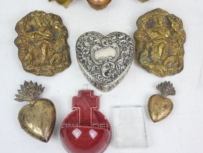 A collection of objects made of brass, silver...