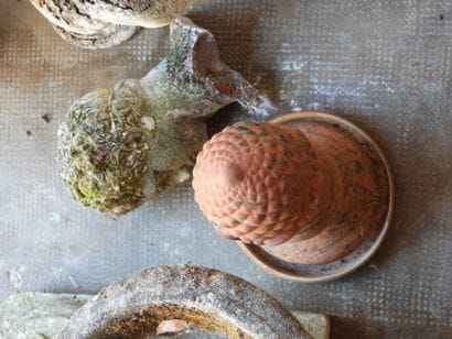 Set of garden ornaments including a pinecone,...