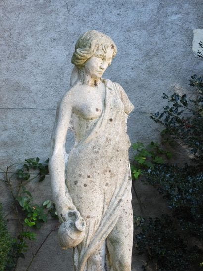 LARGE STATUE of a woman in the classical...
