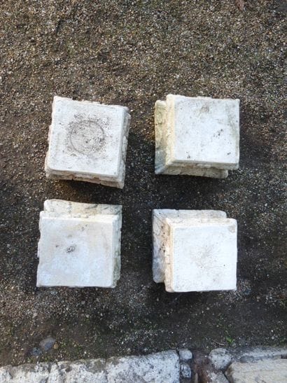 FOUR RECONSTITUTED STONE CAPITAL BASES. 29...